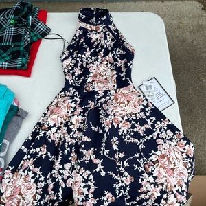 Dark blue with pink and white flowers from Macy’s juniors size 0.